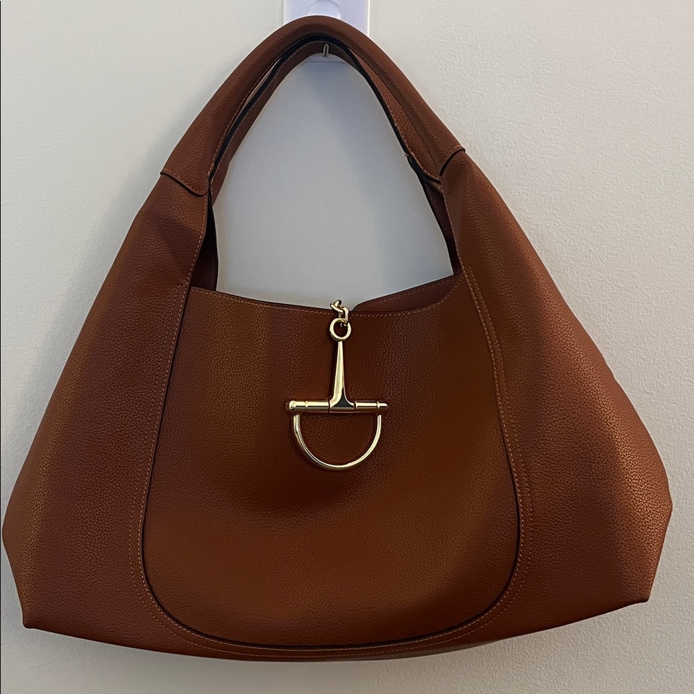 Brown women's purse with magnetic closure